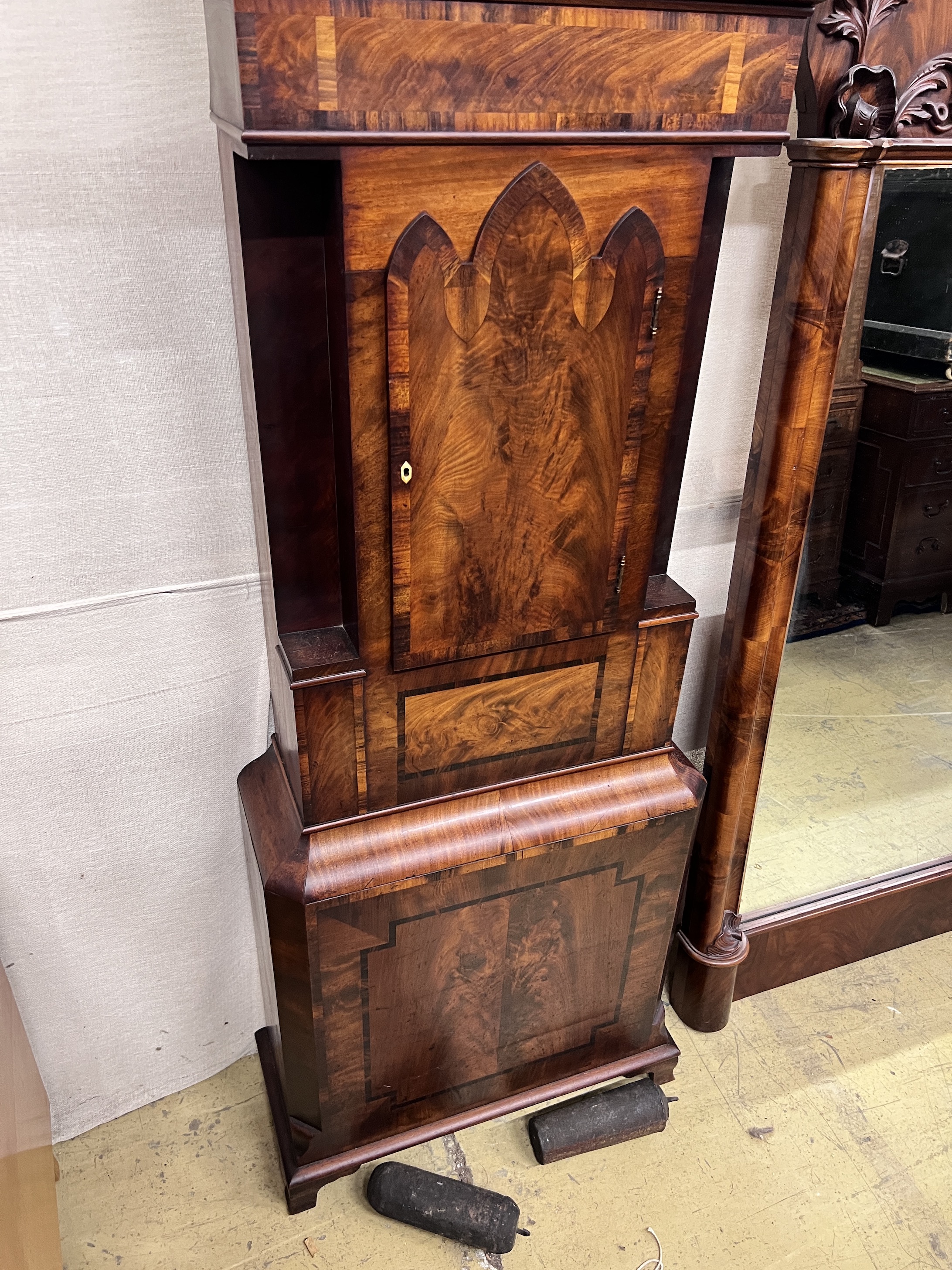 Scott & Son, Kendall. An early 19th century flame mahogany longcase clock, height 230cm